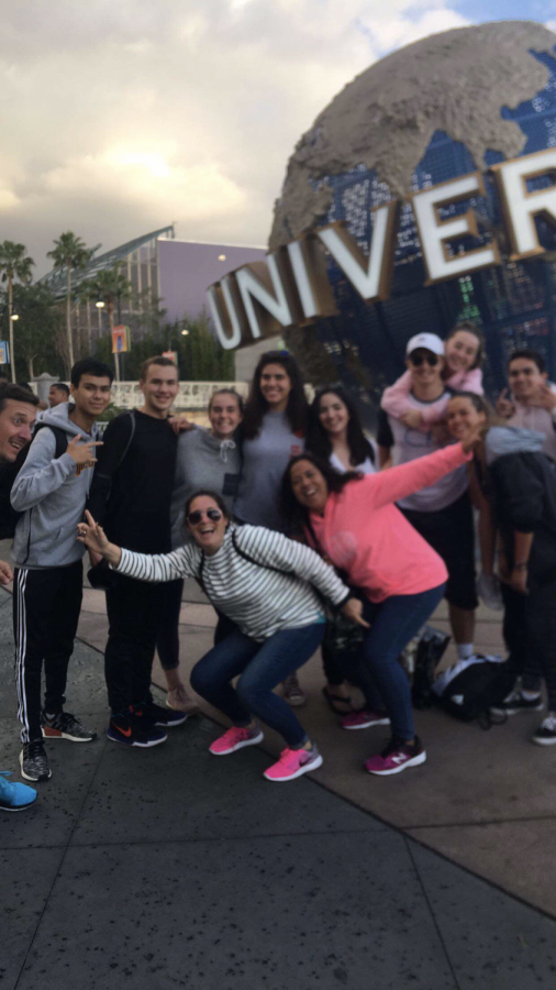 Sophomores stand at the entrance of Universal Studios.