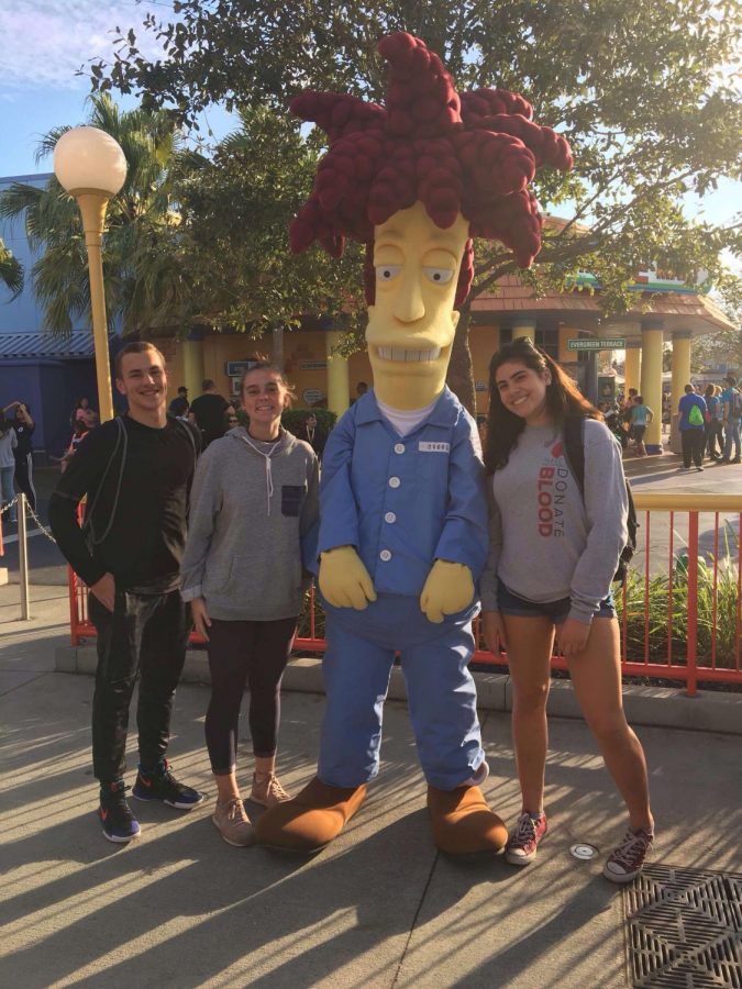 Jonnathan Gonzalez, Elodie Tardits and Isabela Garcia posing with Slideshow Bob from the Simpsons.