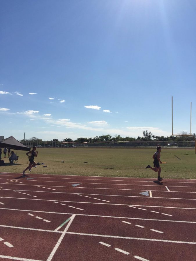 Gables+competes+versus+Miami+Sunset+Senior+High+School+in+the+4x400+relay.