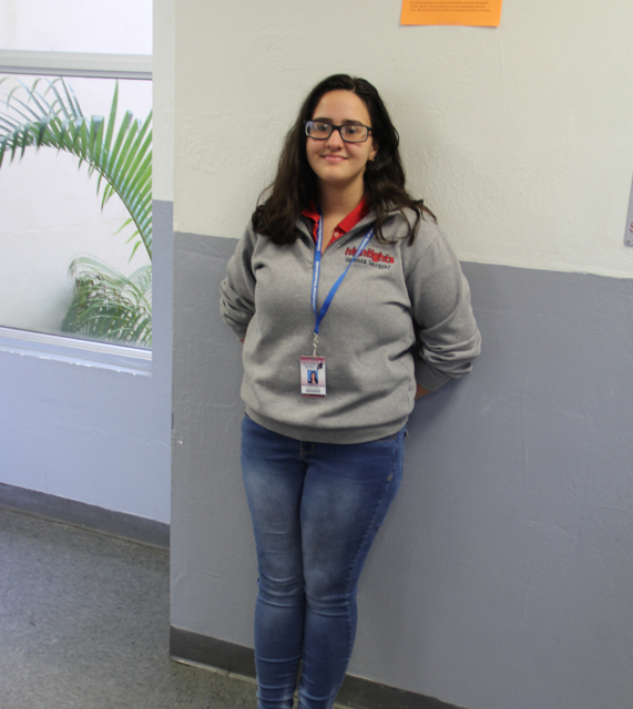 Gables student wearing her uniform and ID.