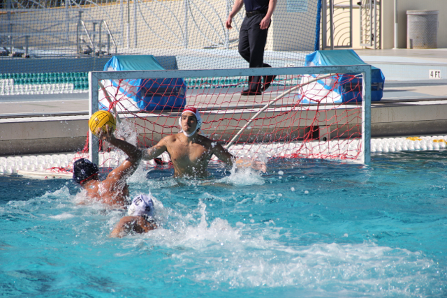 A Cavalier goalkeeper braces himself for a scoring attempt by his opponent.