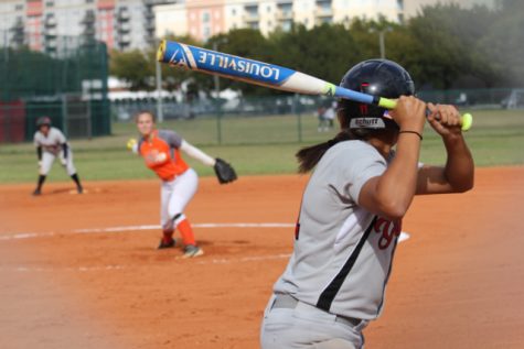 A Lady Cavalier hitter awaits an incoming pitch.