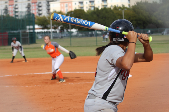 A+Lady+Cavalier+hitter+awaits+an+incoming+pitch.