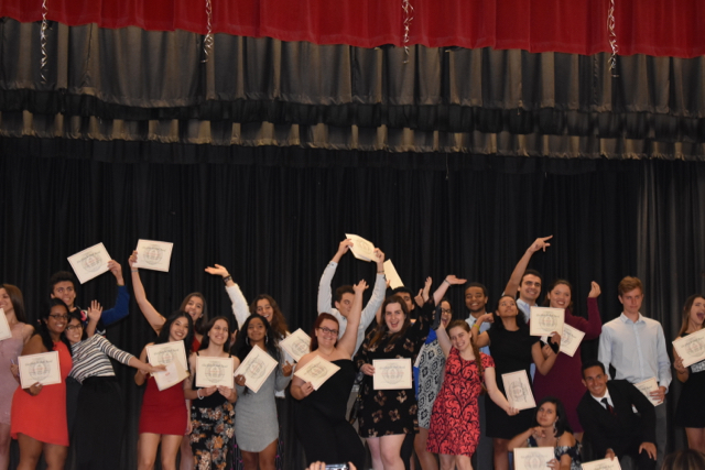 Seniors+celebrate+after+receiving+their+awards.