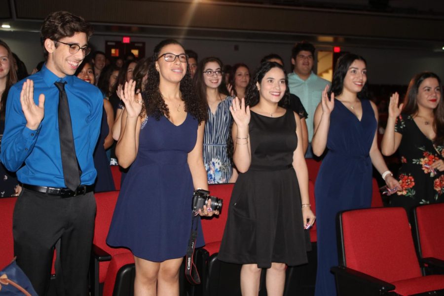 Students take the NHS pledge. 