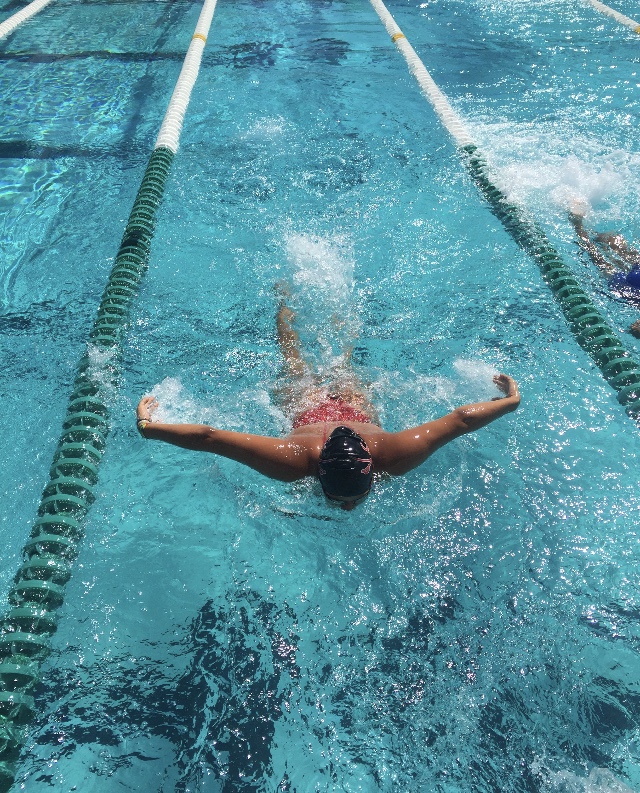 Senior Camila Torres practices her stroke during swim practice at Ransom Everglades. 