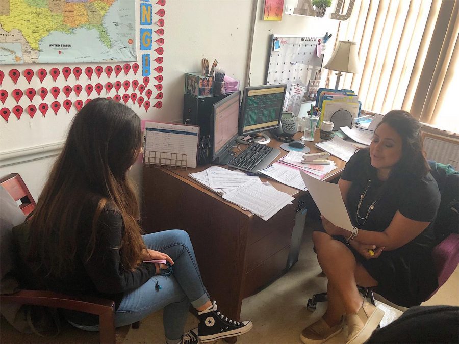 Counselor Ms. Driver guiding a student on mental health.