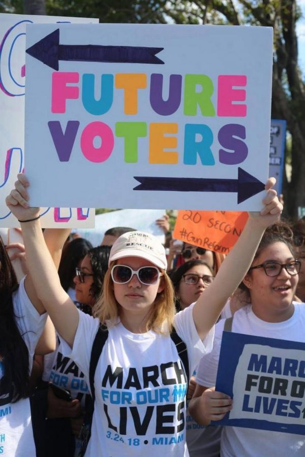 Sophomore Mia Crabill stands at the March For Our Lives protest on March 24th. This picture was used on the cover of the Miami Herald following the protest.