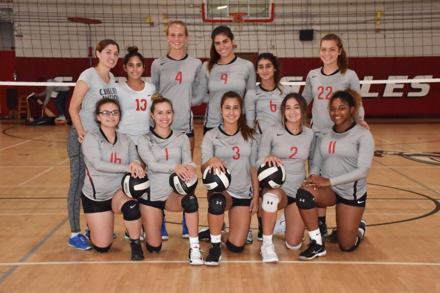 The+Coral+Gables+Senior+High+Girls+volleyball+team+poses+for+a+team+photo+at+he+beginning+of+the+season.+