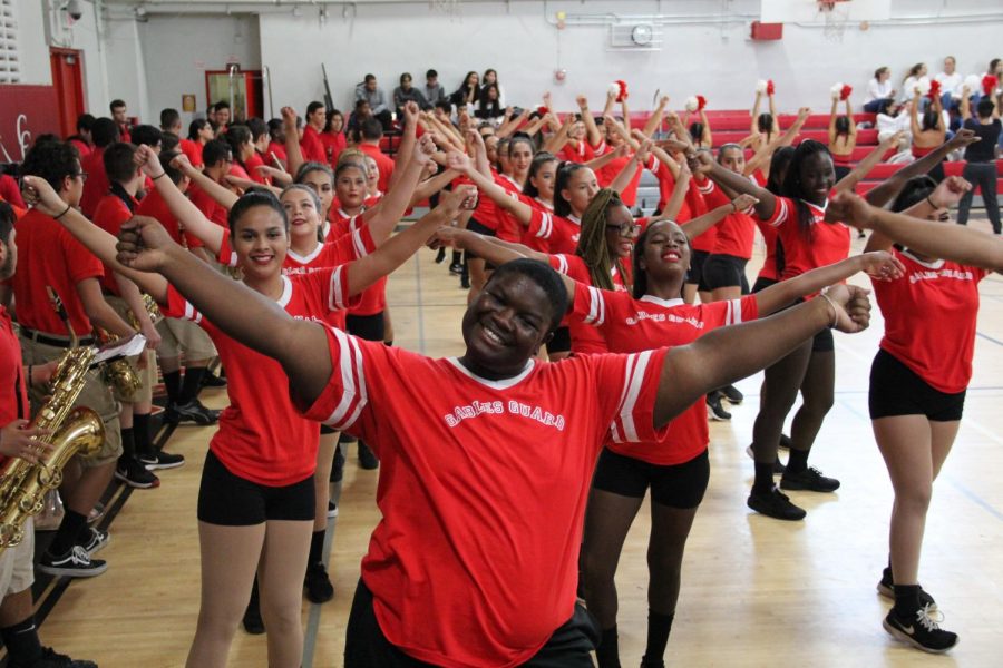 Members of Color Guard showing off the dance moves they have  been practicing since before school started.  