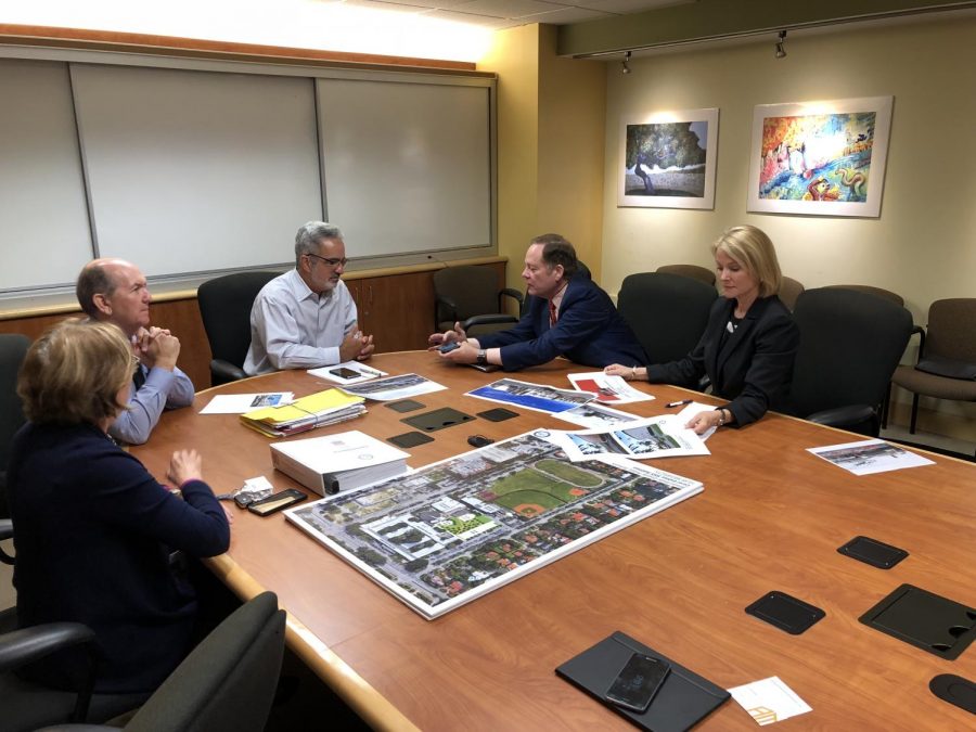 June Morris, Allen Morris, Jaime Torrens, and Victor Alonso collaborating on renovation plans for Gables High. 