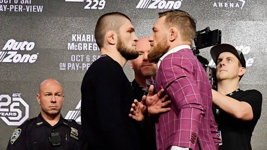 UFC CEO Dana White separates Khabib Nurmagomedov and Conor McGregor during a press conference.