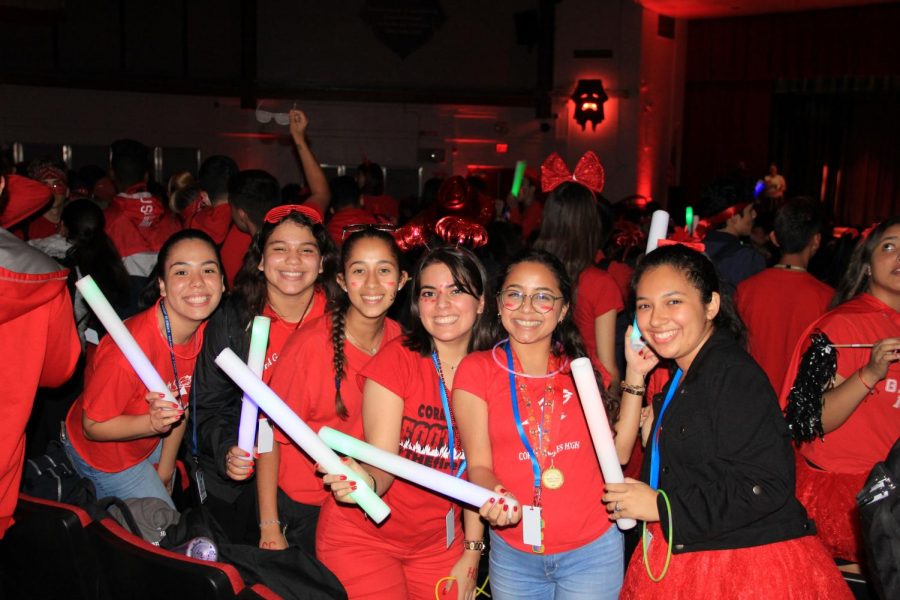 Seniors at the senior pep rally holding some of the props given out to them. 