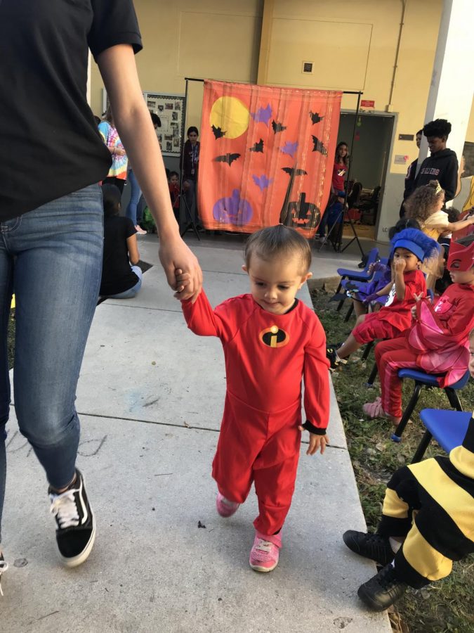 Little Cavalier showing off his Incredibles costume at the Halloween Fashion show.
