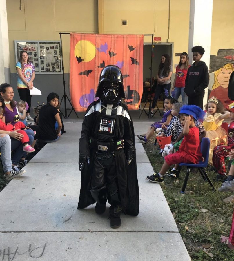 Little Cavalier modeling Batman costume at the Halloween Fashion Show.