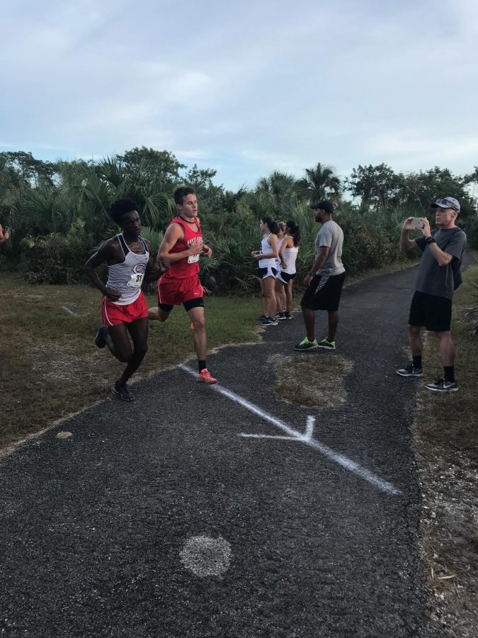 Junior Colin Wilson runs against the competition at Regionals.