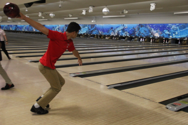 Junior Kevin Monjarrez prepare to send the ball down the alley in a bowling match.