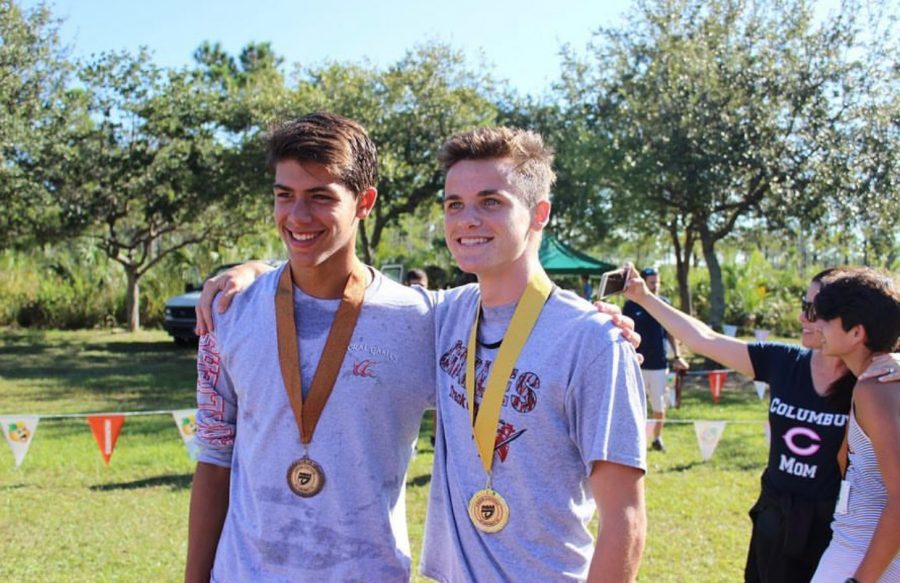 Freshmen Etienne Montigny (left) posing with teammate after a successful district competition.