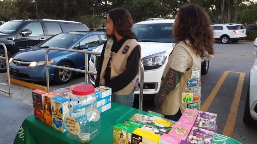 Girl scouts selling cookies to raise money.