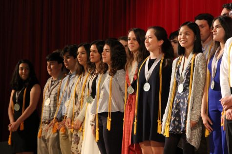 The seniors receiving Summa Cum Laude stand proudly during the awards ceremony.