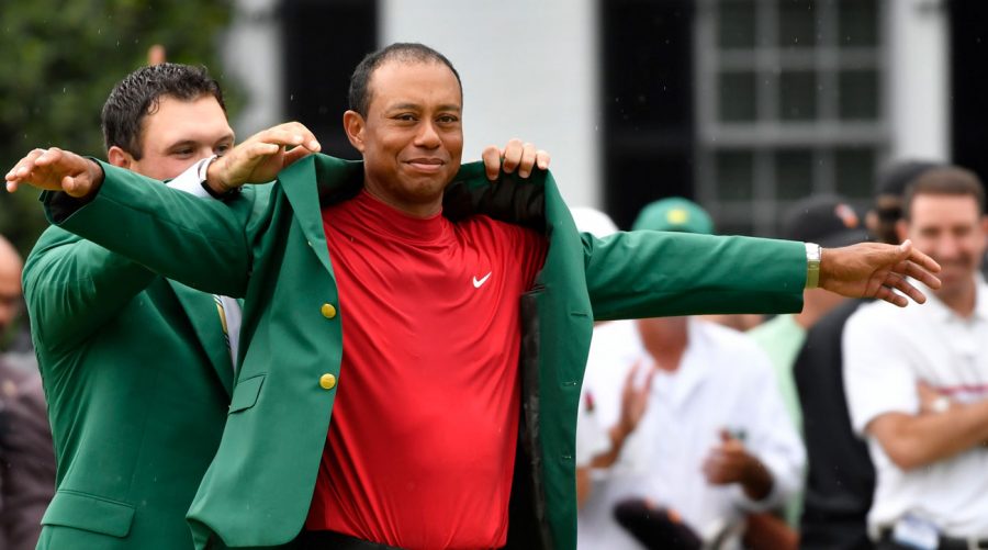 Golfing+legend+Tiger+Woods+receives+his+fifth+green+jacket+after+winning+the+2019+Masters+tournament.