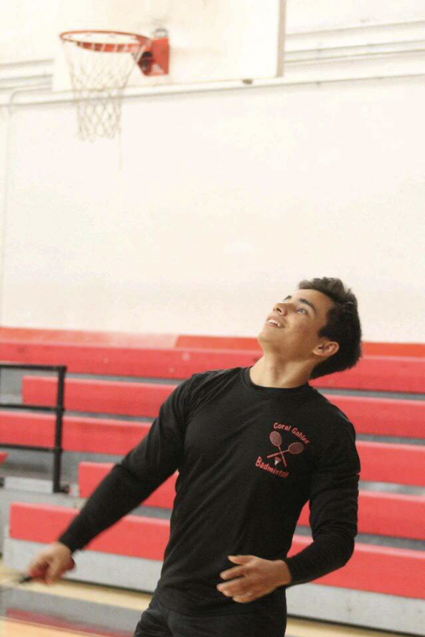 Captain Andrew Aramayo eyes the birdie during badminton practice at the school gym.