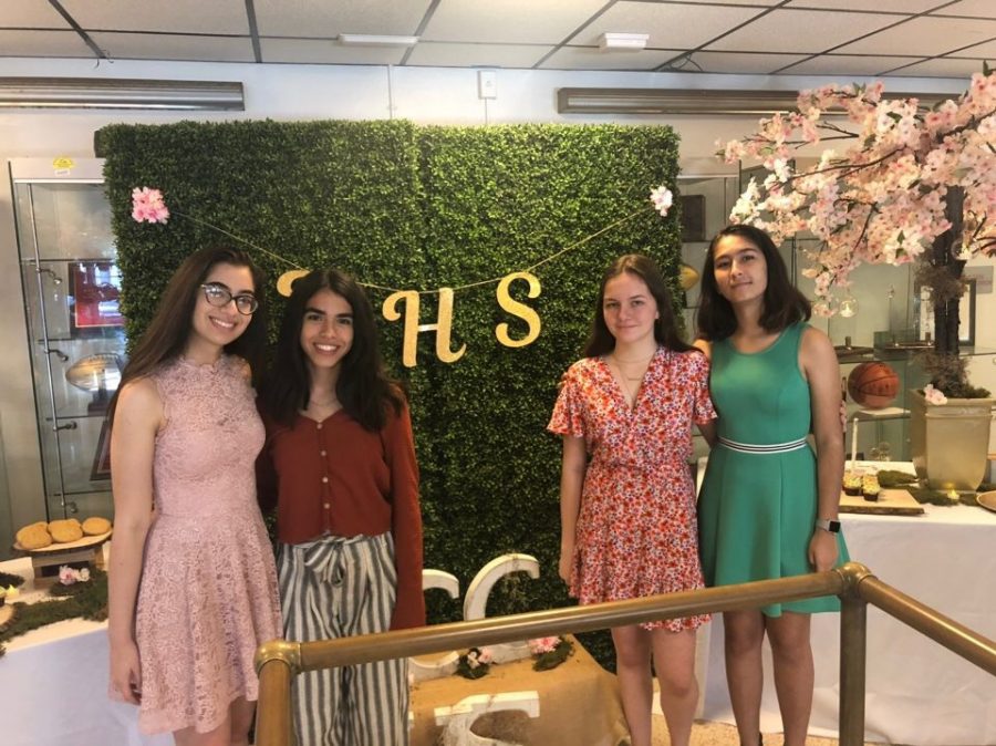 NHS board member Lia Sanchez, Mindy Miranda, Ellie Morris and Isabel Jaen pose for a picture after induction.