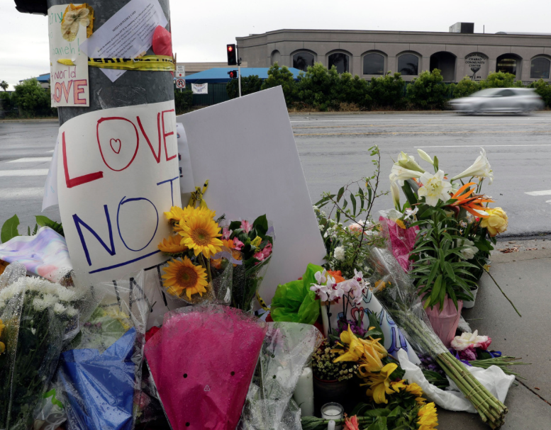 A memorial for the victims lies in front of the temple, following the shooting.