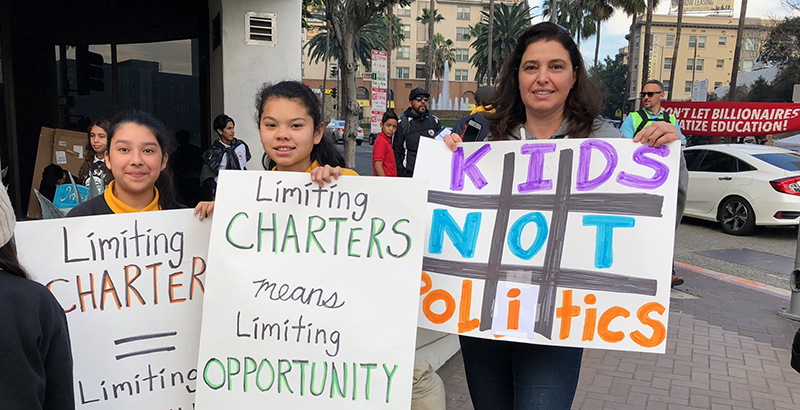 Students protest the lack of funding going towards charter schools.