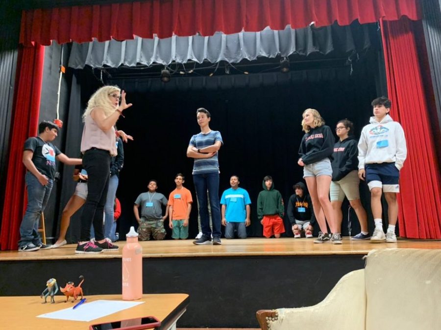 IB+Theater+teacher+Ms.+Barrow+coaches+campers+representing+Germany+on+their+skit+during+CavsCamp.