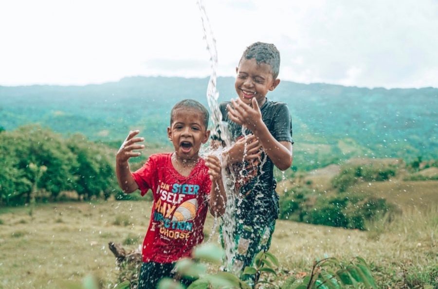 Ecstatic children in the Dominican Republic celebrate Water Day.