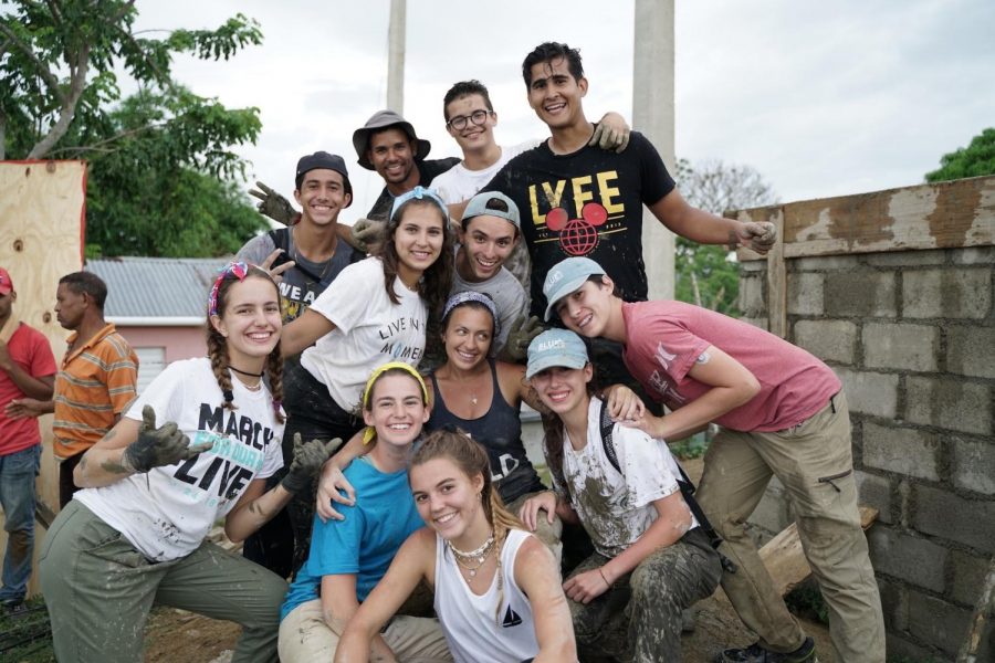 BLUE Missions Volunteers pose for a group picture after a hard days work.