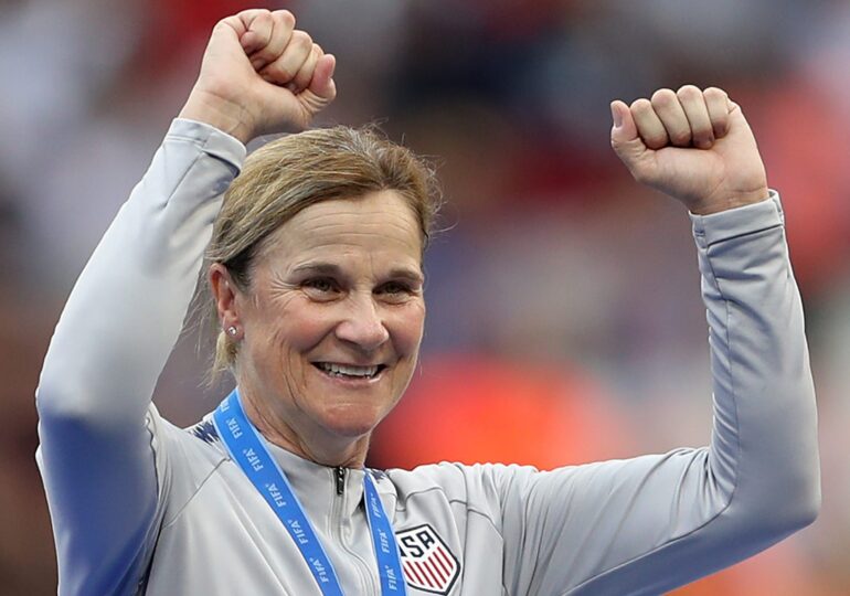 Jill Ellis pumps her arms in the air as she celebrates her second World Cup victory.