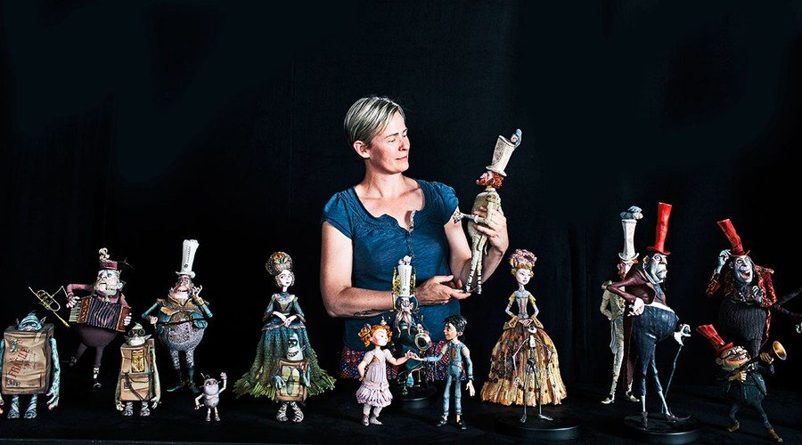 Georgina Hayns, creative supervisor, puppet fabrication, with the cast from