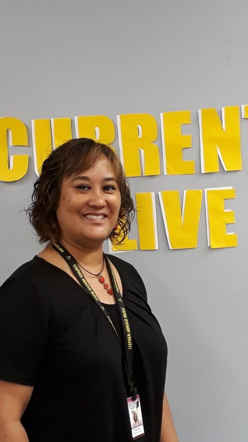 Mrs. Lianne Clark poses for a picture in front of the 'Gables Live!' studio.