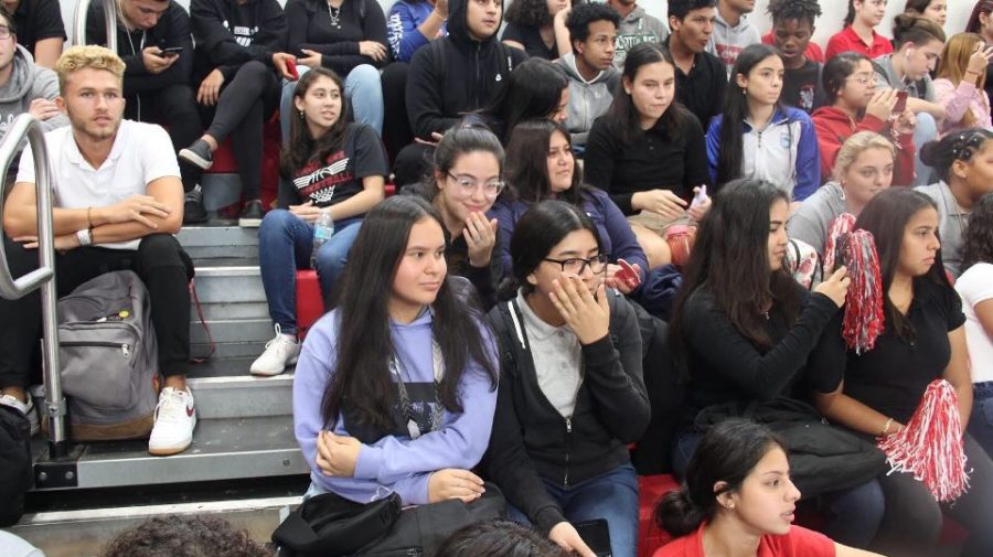 The audience watches in admiration of the performers.