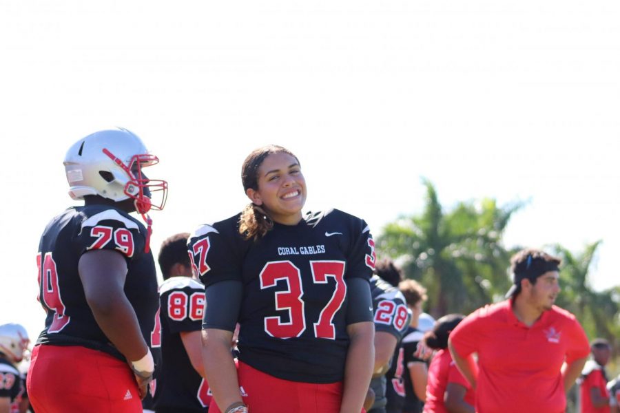 Junior Arianna Gonzalez stands alongside her teammates during practice with the junior varsity Cavalier Football team.