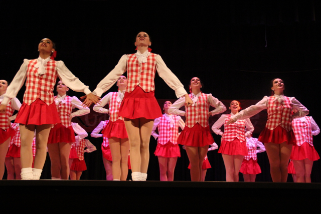 Dancers take center stage during their annual Gablettes Revue showcase as they perform their traditional kick routine.  