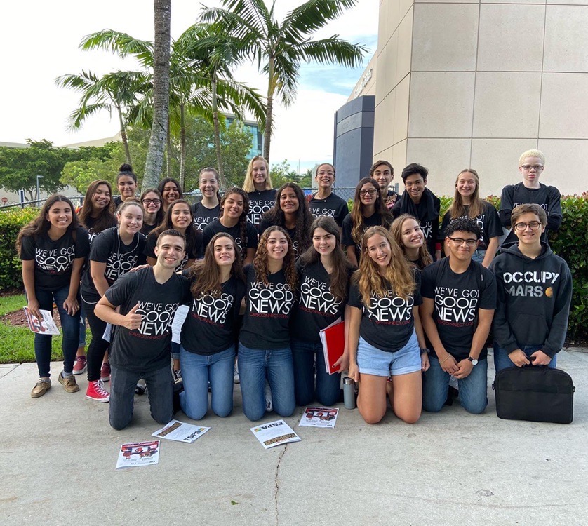 The CavsConnect staff smiles in front of the FIU Graham Center, where the 2019 Journalism Day convention was held.  