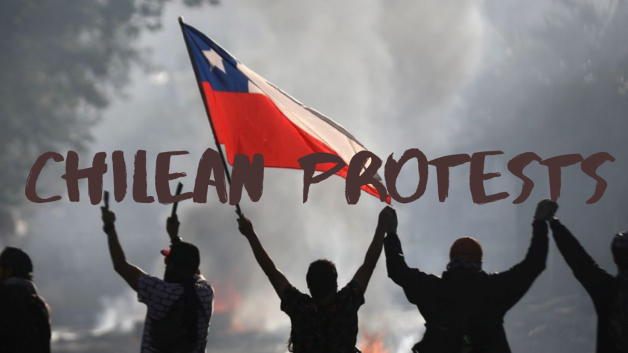 A group of Chilean Protesters in front of a fire