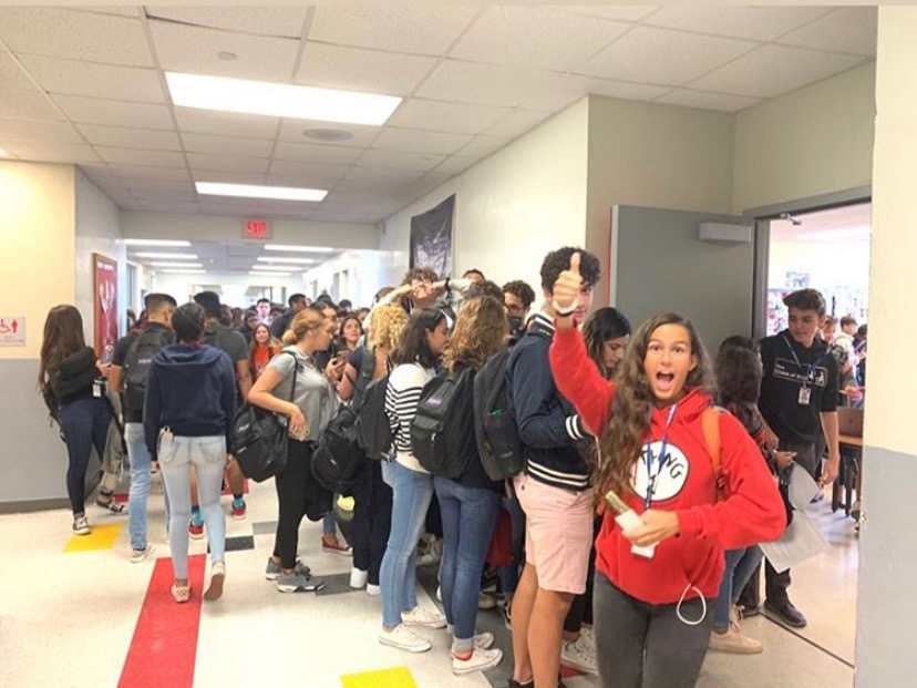 Students excitedly purchasing their homecoming tickets. 