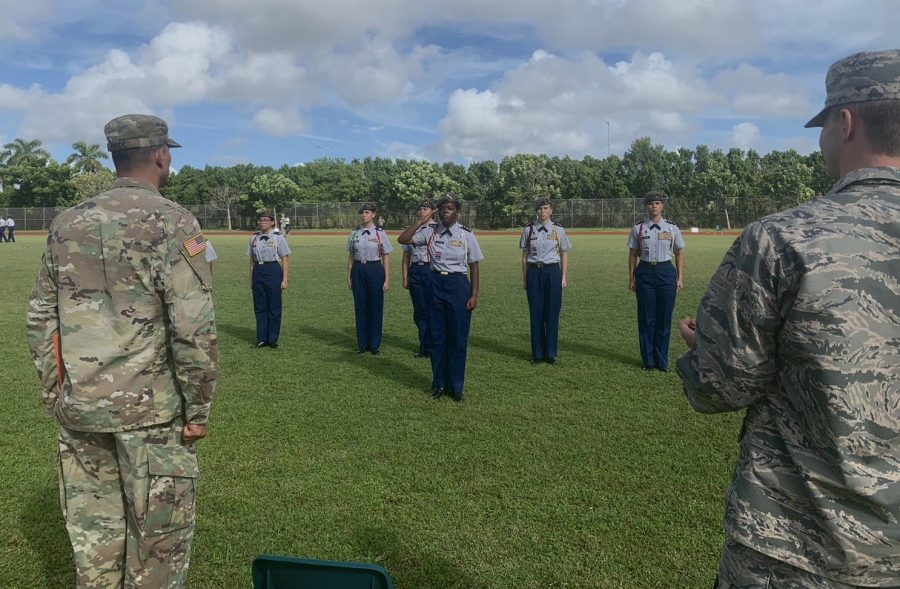 The JROTC stands at attention during their drills, waiting for instructions.
