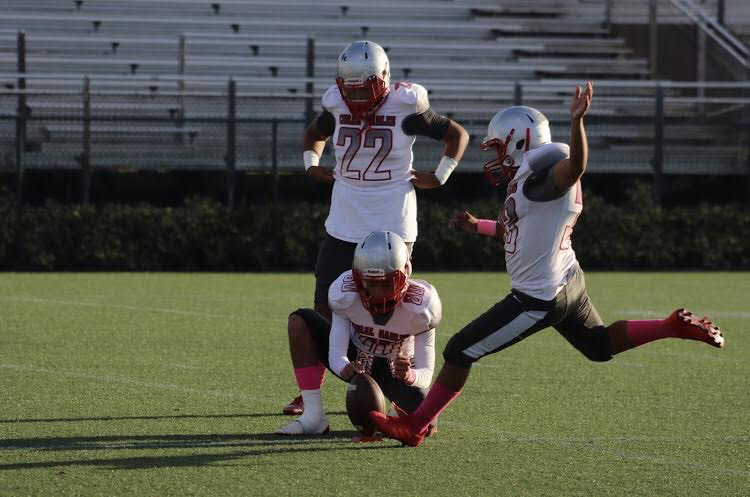 Cavalier football players starting the game off with a punt. 