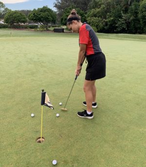 Lady Cavalier golfer Sofia Alfonso practicing her putting before competing in the regional championship competition