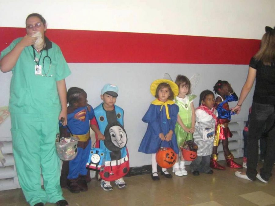 Little Cavaliers line up against the wall dressed in their favorite costume as they take part in the annual trick or treat celebration.