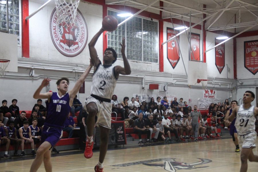 Cavalier Jimel Lane rises up for an emphatic dunk against the Southwest Eagles as the Coral Gables Cavaliers defeat the Eagles 83-63 during their last regular season home game on Jan. 29. 