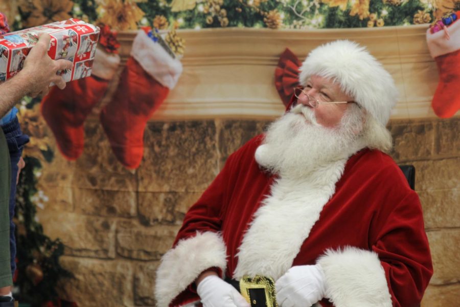 This morning Santa Claus stopped by the Little Cavalier Christmas party and he spent the morning distributing gifts. 