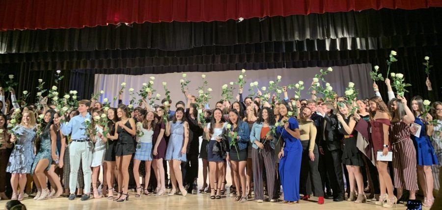 At the end of the ceremony, the junior class gathered on stage to show off their pins and roses.