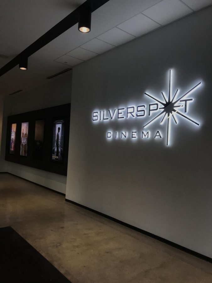 Silverspot theater displays their most recent showings on brightly lit posters.