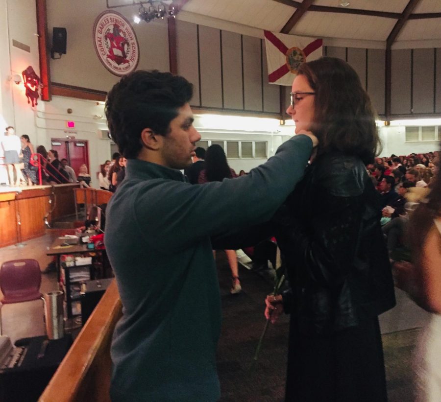 Senior Alejandro Vazquez IB pins junior Mary Rodriguez.